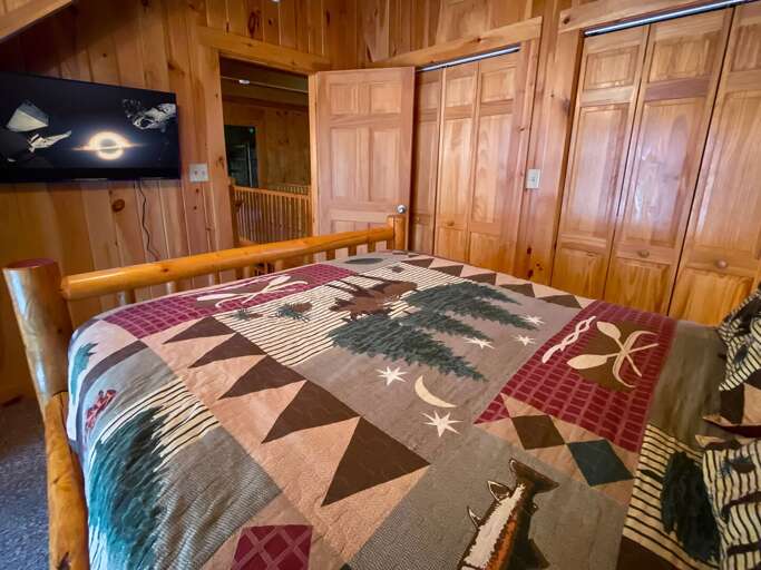 Queen Bed and TV in the Upstairs Room Queen Bed and TV in the Upstairs Room