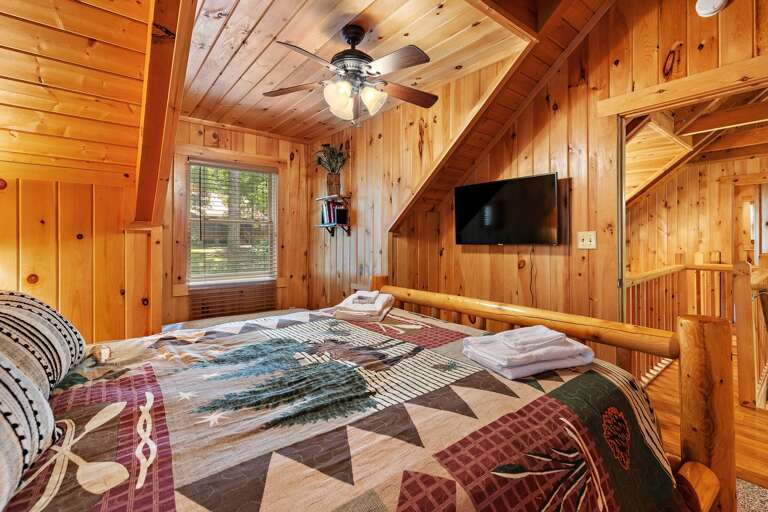 Queen Bed and TV in the Upstairs Room Queen Bed and TV in the Upstairs Room