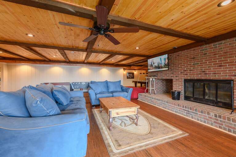 Downstairs Den with Fireplace and Huge HD Smart TV