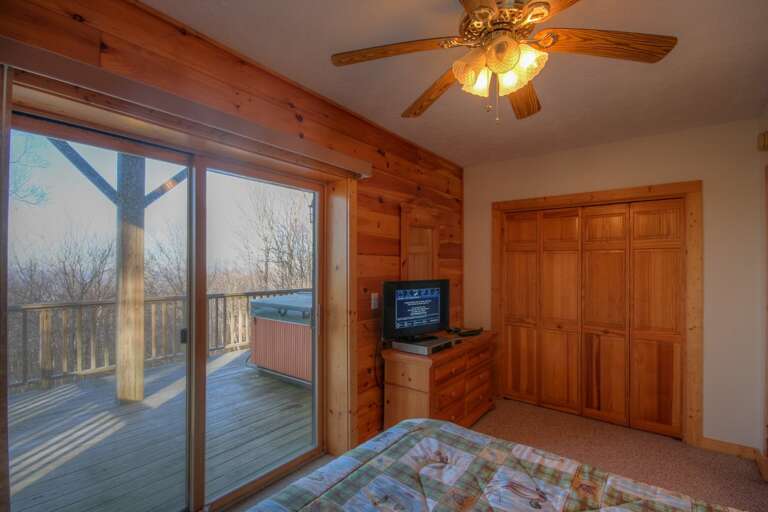 Downstairs Queen Bedroom with Glass Doors to Deck and Hot Tub