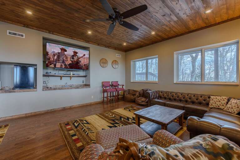 Den Downstairs with Comfy Furniture, Bar, and huge HDTV