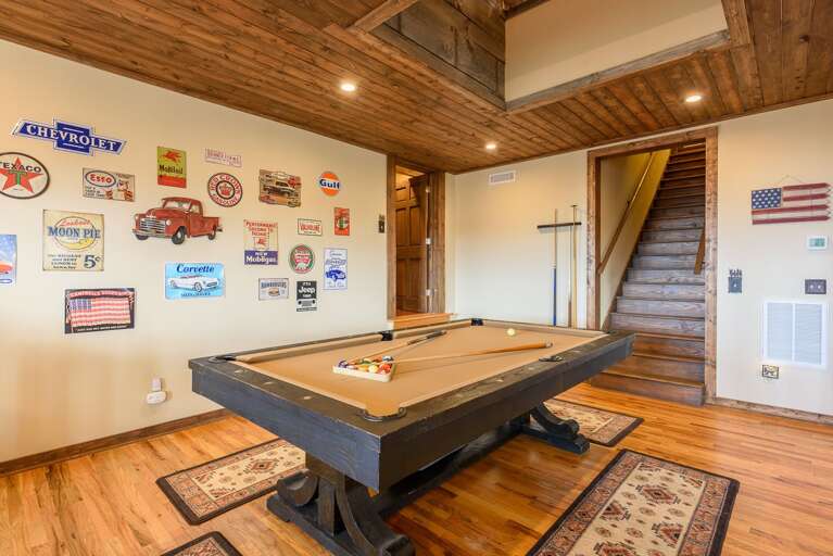 Pool Table centered in Game Room offers lots of elbow room