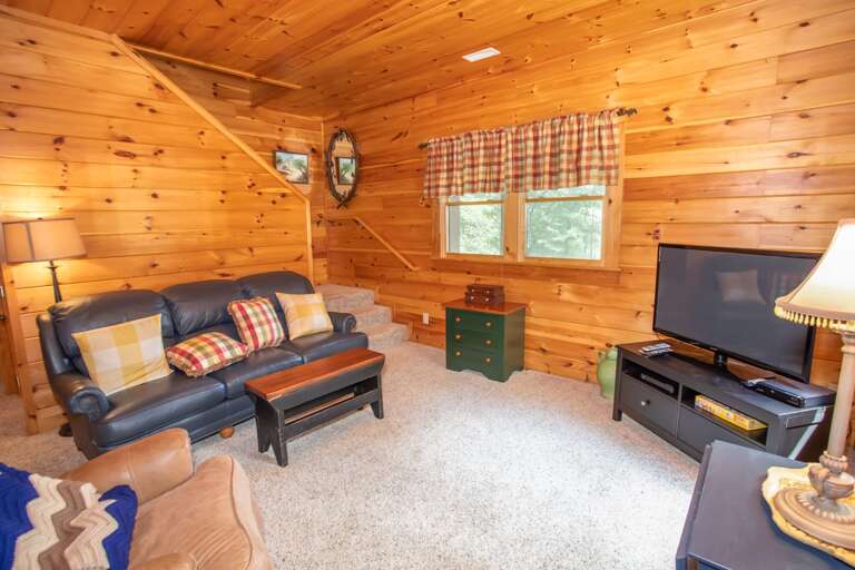 Lower level living area with flat screen TV