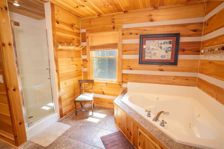 Master bathroom with tub and walk in shower