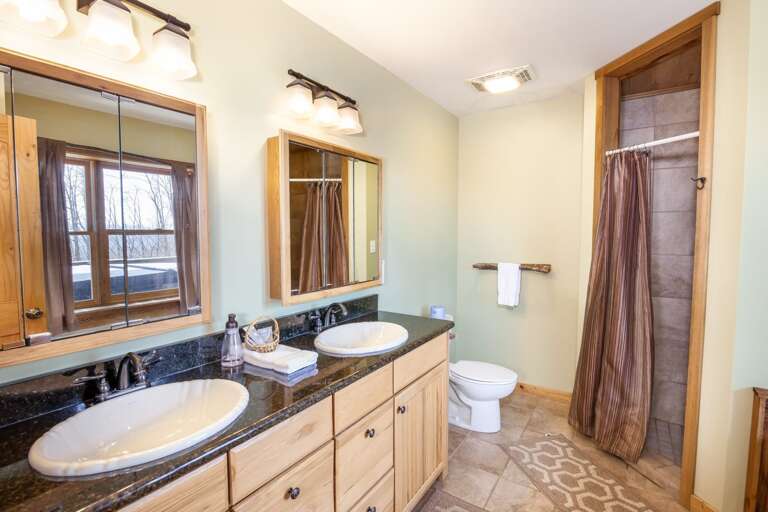 Downstairs Ensuite Full Bathroom with Double Granite Vanity, Jetted Tub, Separate Shower