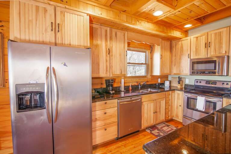 Kitchen with Custom Wood Cabinetry and Stainless Appliances
