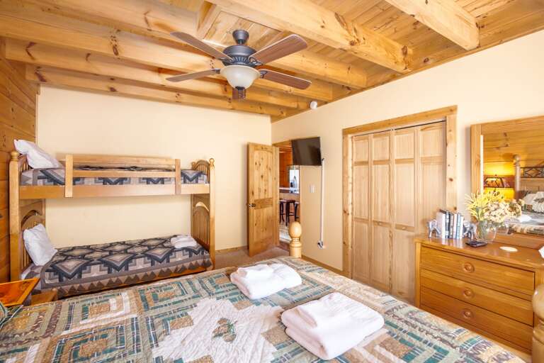 Main Level Bedroom with Queen Bed, and Twin over Twin Bunk Bed
