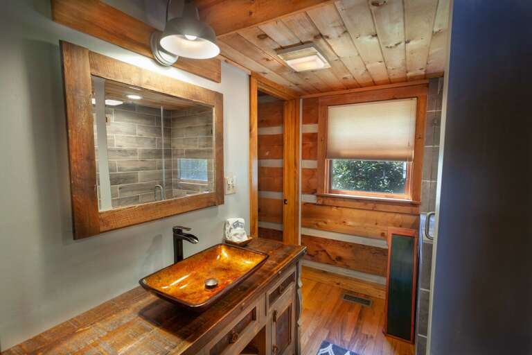Pedestal Sink and Custom Upgrades give this Main Level Full Bathroom a Spa Feel!