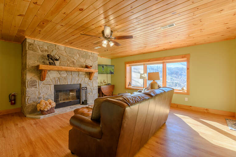 Downstairs Den with HDTV and Wood Burning Fireplace