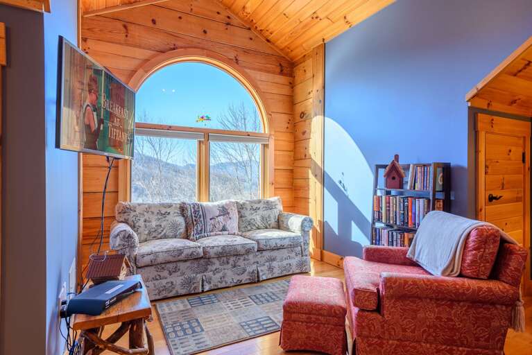 Upstairs first Queen Bedroom with Sitting area and HDTV