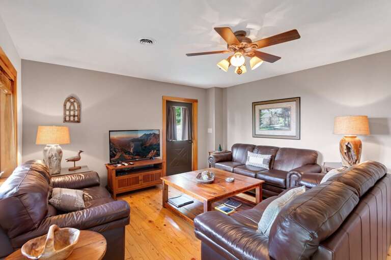 Downstairs Den with HDTV and Leather Sofas