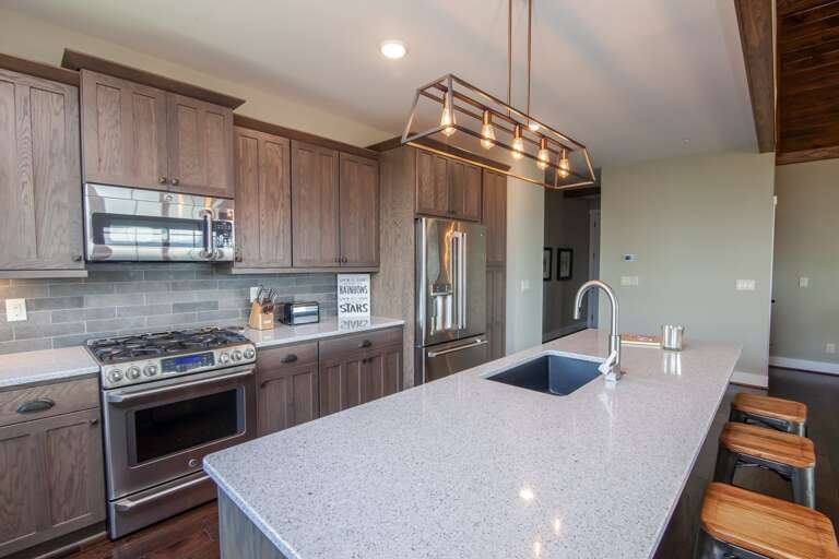 Kitchen with Quartz Counters, Custom Cabinetry, Gas Cooktop Kitchen with Quartz Counters, Custom Cabinetry, Gas Cooktop