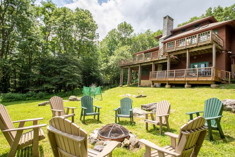 Fire pit in the wide back yard, perfect for family gatherings!