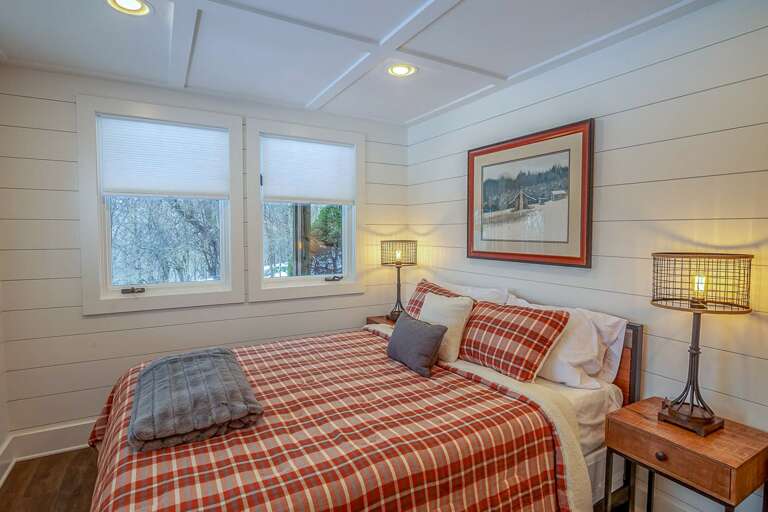 Queen bedroom on lower level with TV