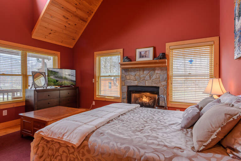 Queen bedroom on Main Level with fireplace, outdoor access, shared bathroom Queen bedroom on Main Level with fireplace, outdoor access, shared bathroom