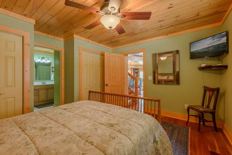 Queen bedroom on main level with TV, shared bathroom Queen bedroom on main level with TV, shared bathroom