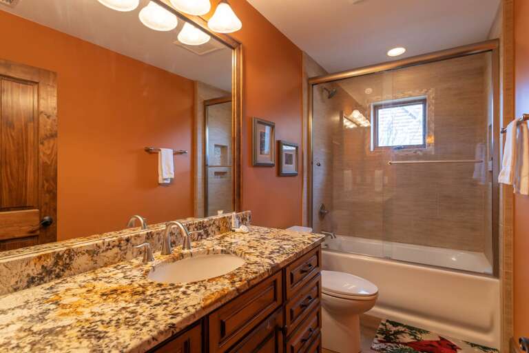 Ensuite Full Bathroom with Tub and Shower in Main Level Queen Suite