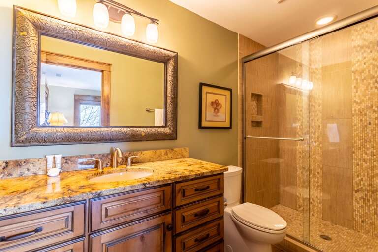 Main Level King Private Ensuite Bathroom with Tile Step-In Shower