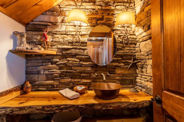 Powder Room on Main Level with Custom Stone and Wood Work, Copper Vessel Sink