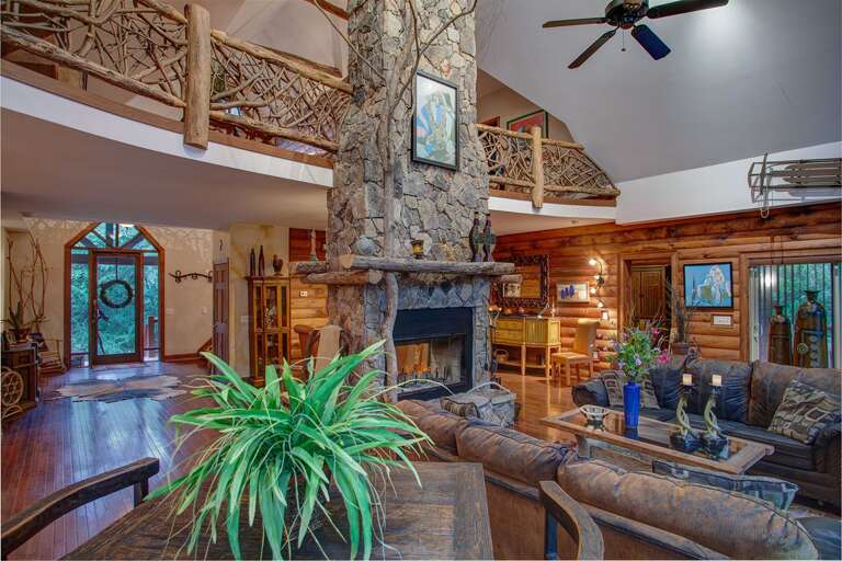 Leather Sofas in Great Room between Wood Burning Fireplace and HD Smart TV Leather Sofas in Great Room between Wood Burning Fireplace and HD Smart TV