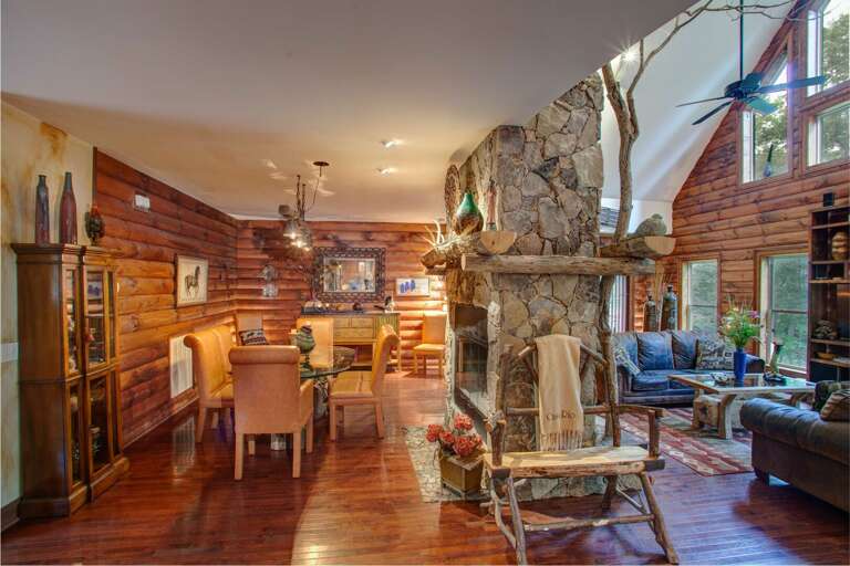 Stacked Stone Fireplace central to Great Room and Dining Room Stacked Stone Fireplace central to Great Room and Dining Room