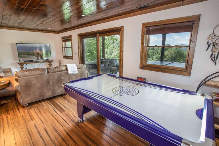 Game Table and Sitting Area with HD Smart TV in Downstairs Family Room