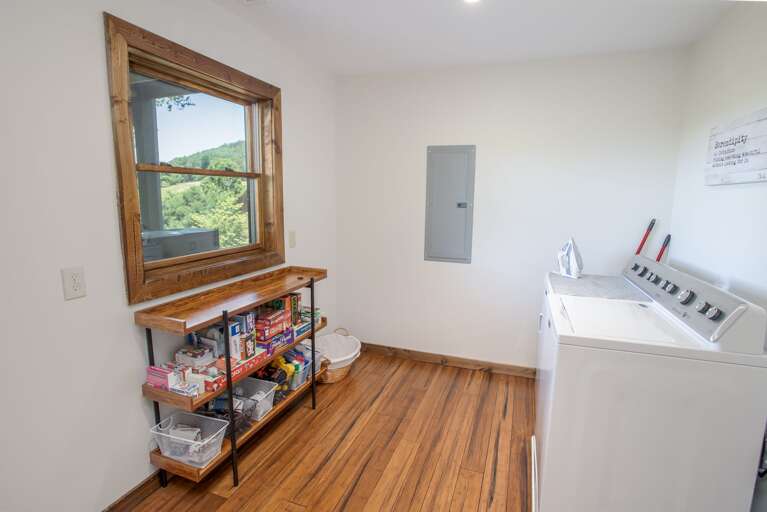 Laundry Room with Washer & Dryer, Shelves with Puzzles and Games