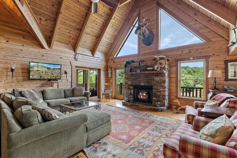 Spacious, Comfortable Living Area, View Windows, Stacked Stone, Gas Logs, Designer Fabrics, and Mounted TV