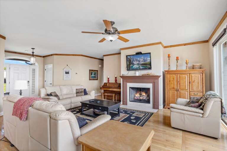 Large Living Area with Long Range View, Fireplace, and TV