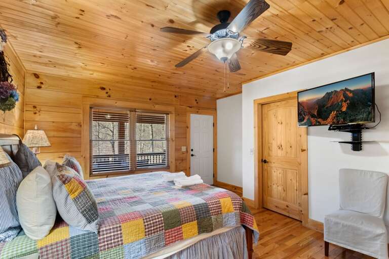 Elk Laurel Master King Bedroom with a King Bed, Flat Screen TV and Deck Access