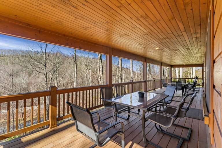 Spacious Covered Deck with Plenty of Outdoor Seating and Dining