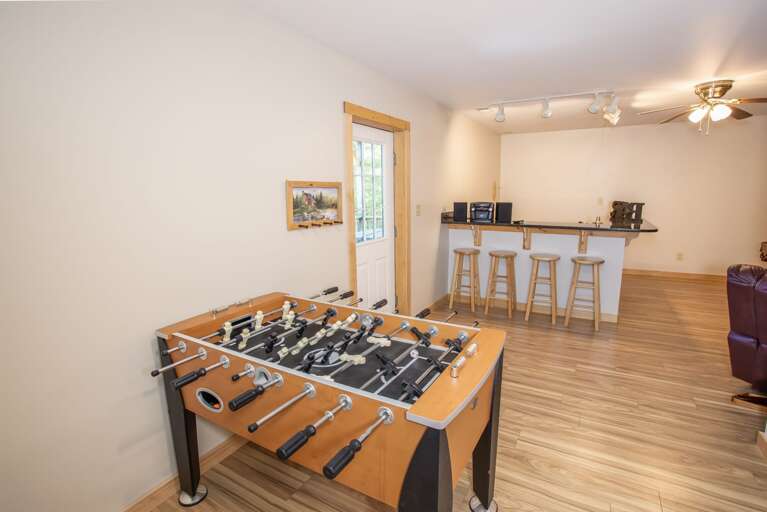 Fireside Lodge Game Room with Pool Table, Foosball, Flatscreen TV, Gas Fireplace and Bar with Granite Counters