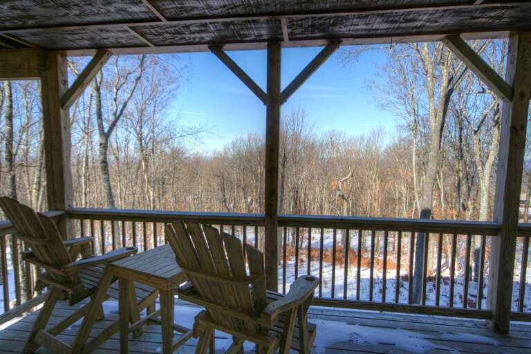 Lower Porch with Seating Under Roof Next to Hot Tub