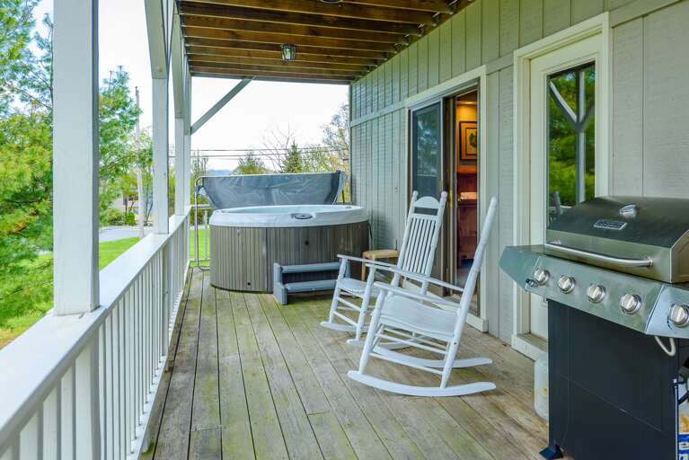 Covered porch with hot tub, grill, rocking chairs