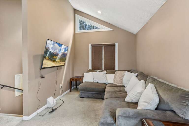 Loft Movie Space with Big Screen TV and Plush Sectional