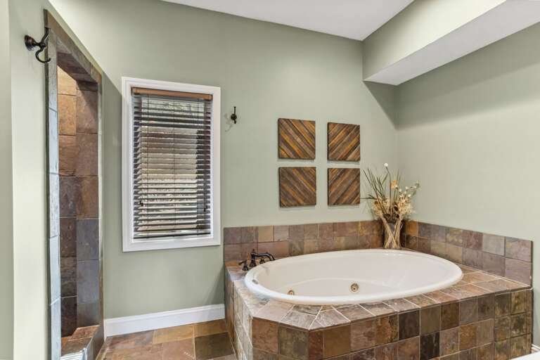 Master Bathroom with a Jetted Tub and Tiled Step in Shower