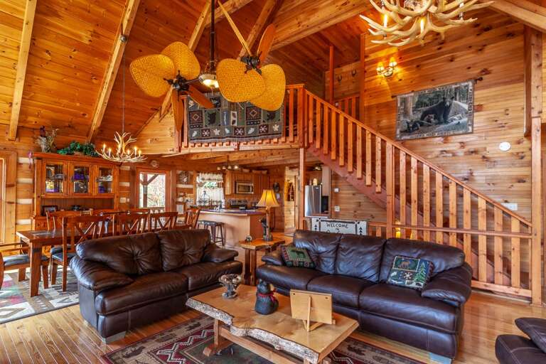 Leather Furniture, Live Edge Coffee Table, and Antler Chandeliers in Great Room