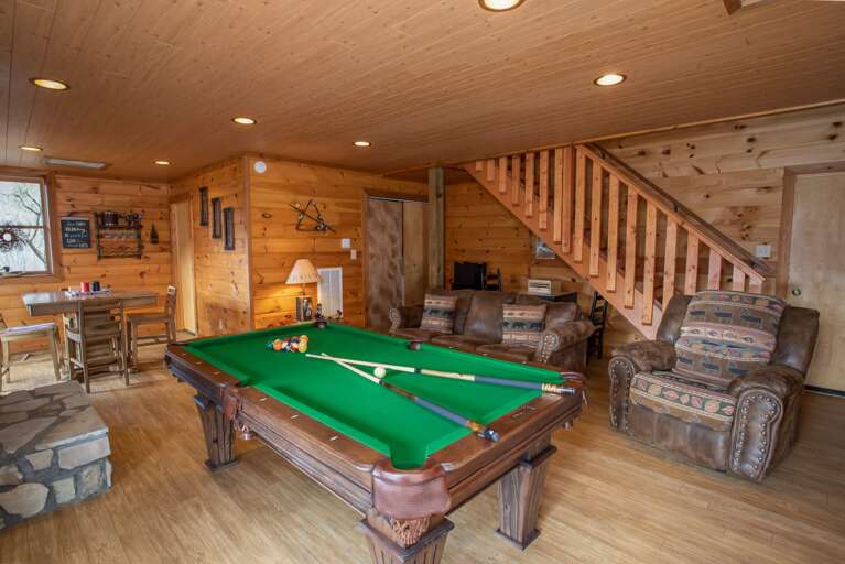 Lower Level Den Includes Pool Table, Comfy Seating, and Deck Access
