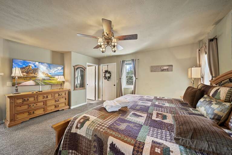 Door to Private Deck and Large Screen TV in the Master