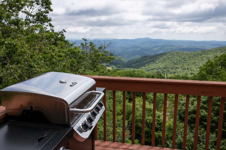 Gas Grill, Outdoor Dining, Comfy Seating, Fire Table, and Mountain Views - all from the deck at Four Diamond Escape
