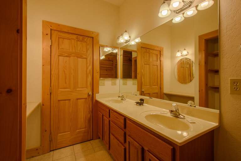 Main Level Bathroom Accessible from Hallway and One of Two Queen Bedrooms