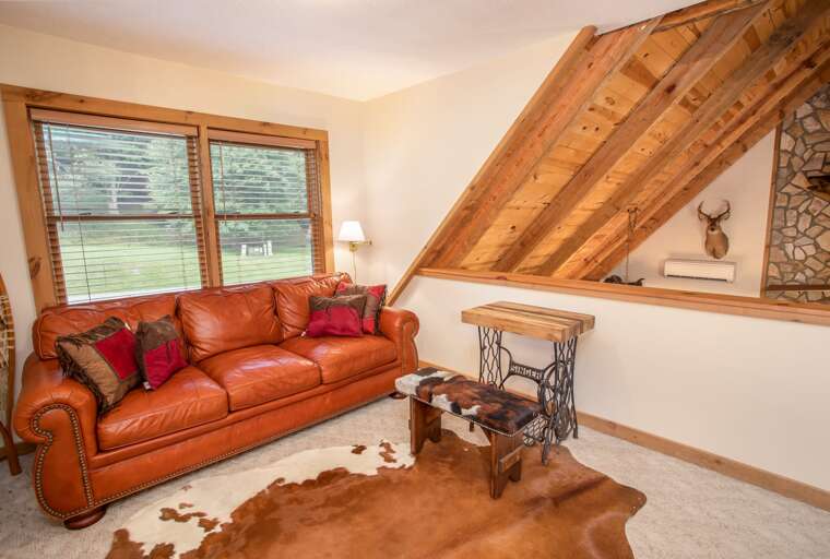 Cozy Seating Area Upstairs with Comfy Leather Sofa