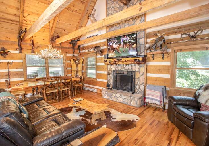 Great Room with HD Smart TV and Floor-to-Ceiling Stacked Stone Wood-Burning Fireplace