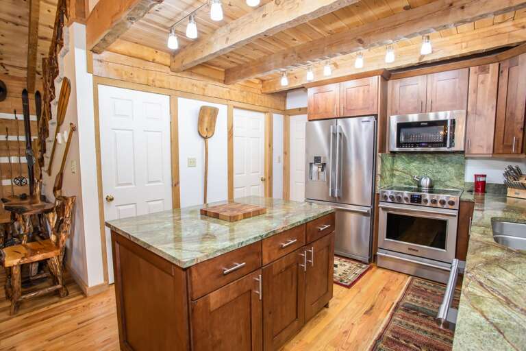 Kitchen boasts Center Island and Custom Shaker-Style Cabinets