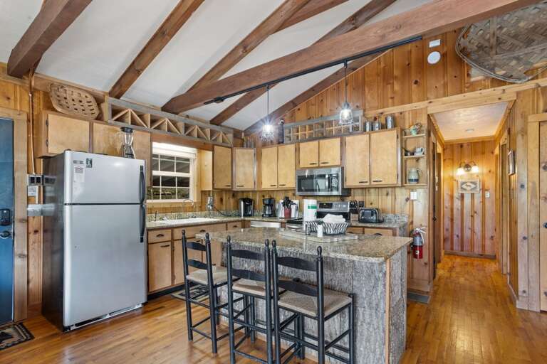 Well Equipped Kitchen with Island Bar Seating