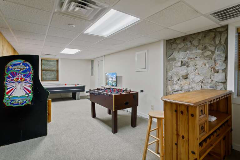 Game room with Mini Bar, Foosball Table, Air Hockey, and Arcade Game
