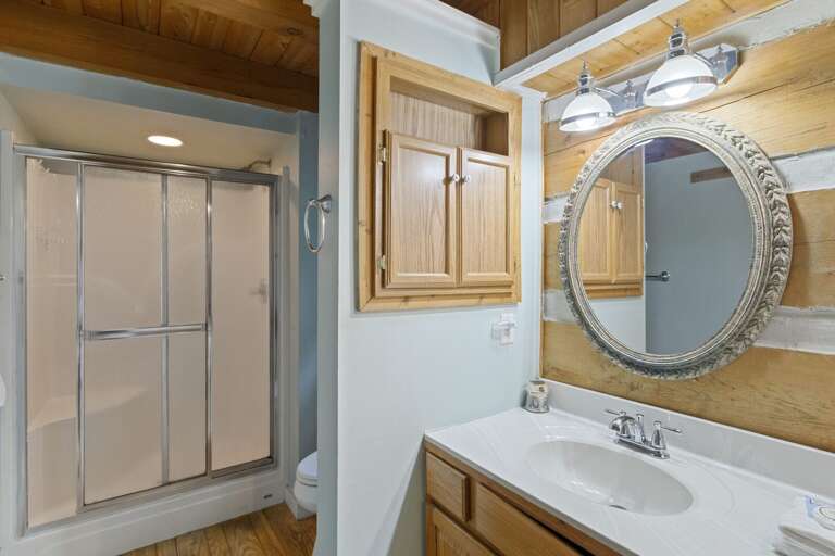 Master Bathroom with Double Vanity, Shower, and Jetted Tub