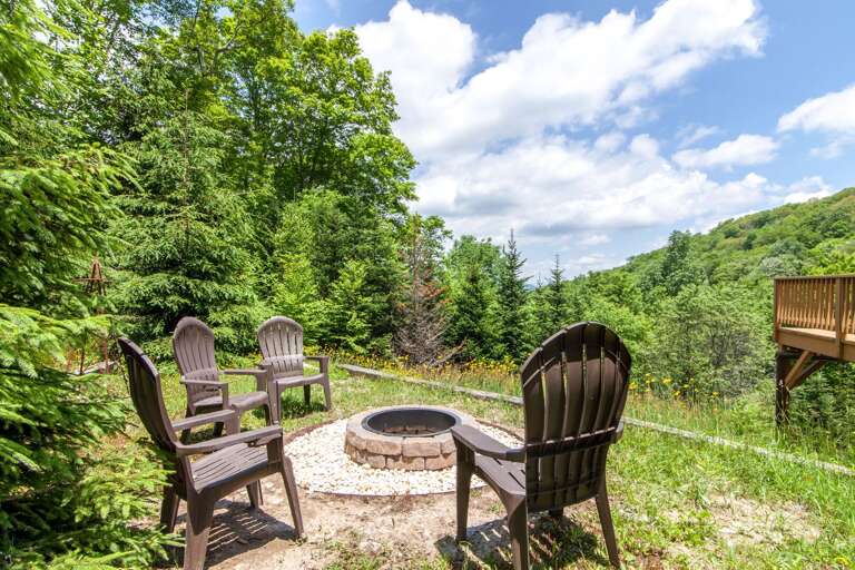 Fire Pit with Seating Off the Main Level of the Home (see corner of main level deck in background)