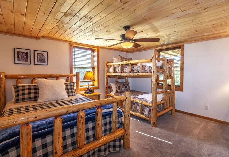 Downstairs Bedroom with Queen Bed and Twin over Twin Bunk Beds