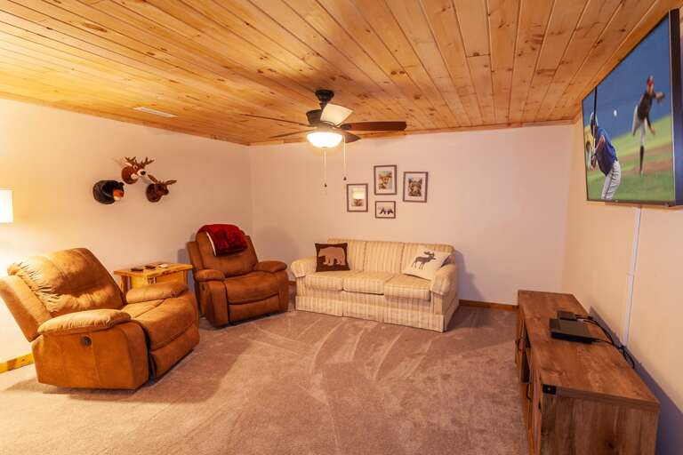 Downstairs Den and Media Room with Comfy Casual Furniture and Huge HDTV